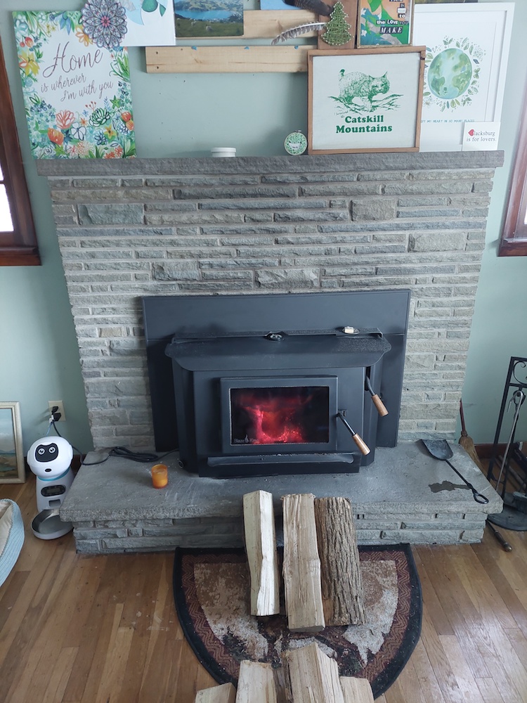 Firewood staged in front of stove