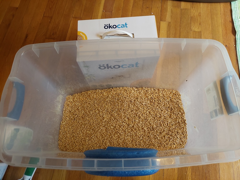 Okocat wood pellet cat litter in a litter box.