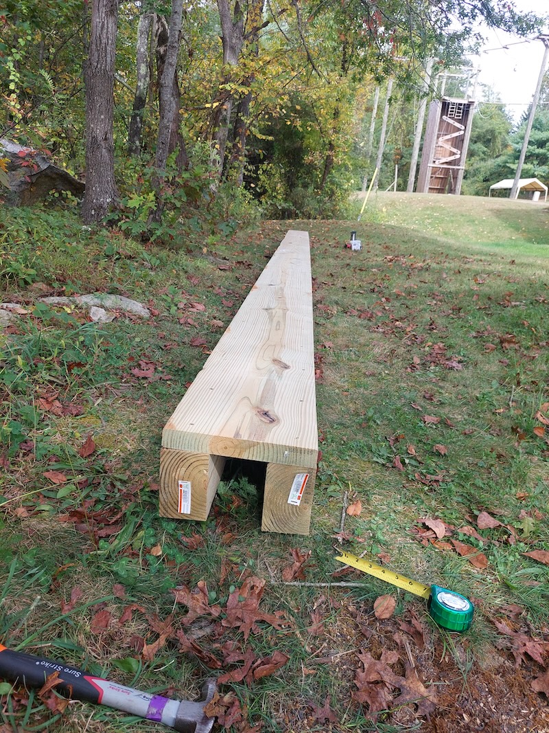 Culvert side boards attached to the bottom board, creating a long, narrow three-sided box.