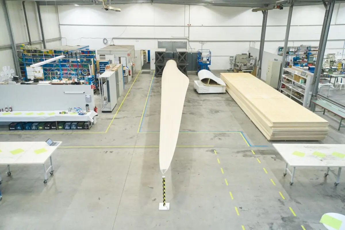 Picture of a wooden turbine blade in a shop.