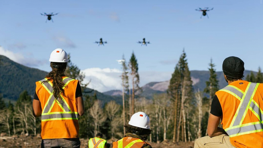 Manning tree-seed-planting drones.