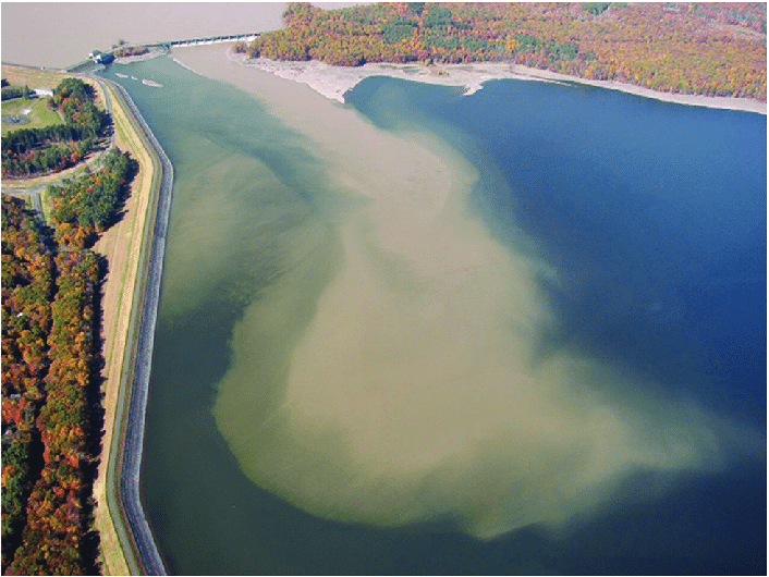 Plume of turbid water entering the east basin of New York City's Ashokan Reservoir following an extreme runoff event. The increase in extreme precipitation events in many regions of the world will decrease UV transparency, the potential for solar disinfection of parasites and pathogens, and increase the cost of effective disinfection of drinking water sources. Photo taken by Randall Hurlbert. 
